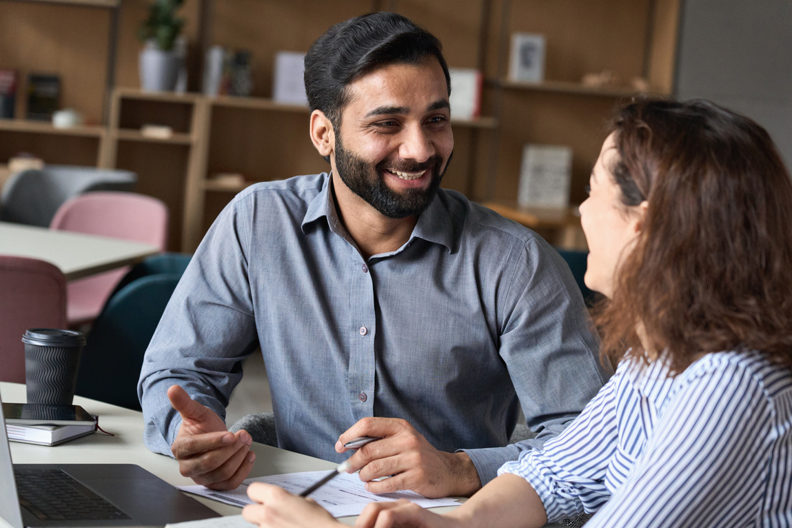 Happy Manager and Young Employee at the Office